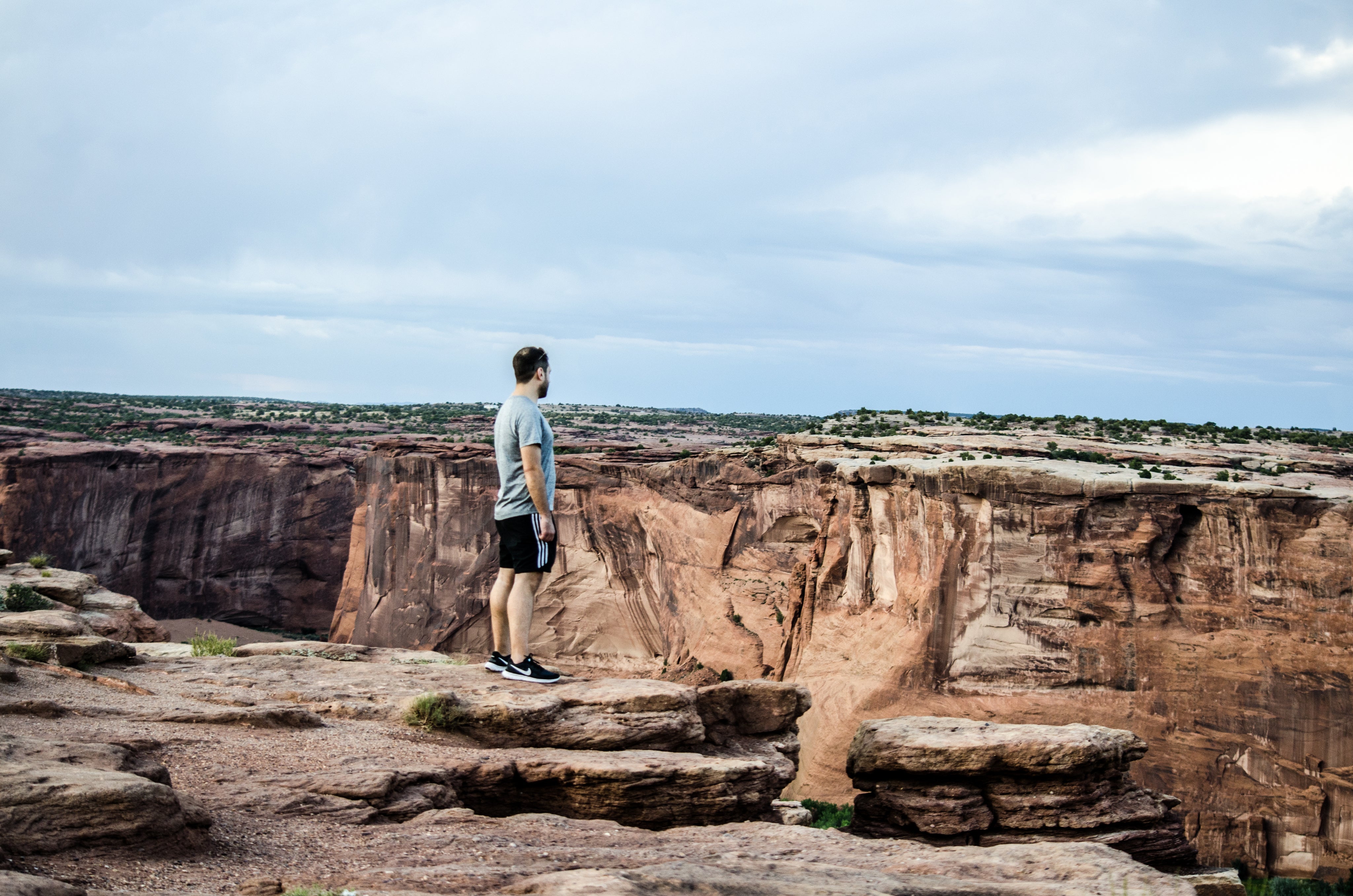 files/a-man-on-a-rocky-plateau-overlooks-a-deep-canyon_1.jpg